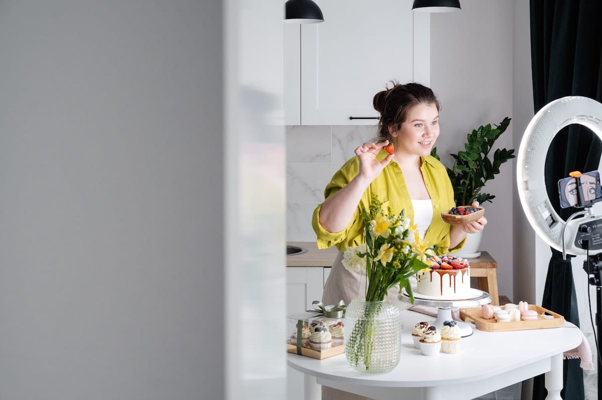 Image of woman figuring out how to make money as a content creator by filming Youtube videos