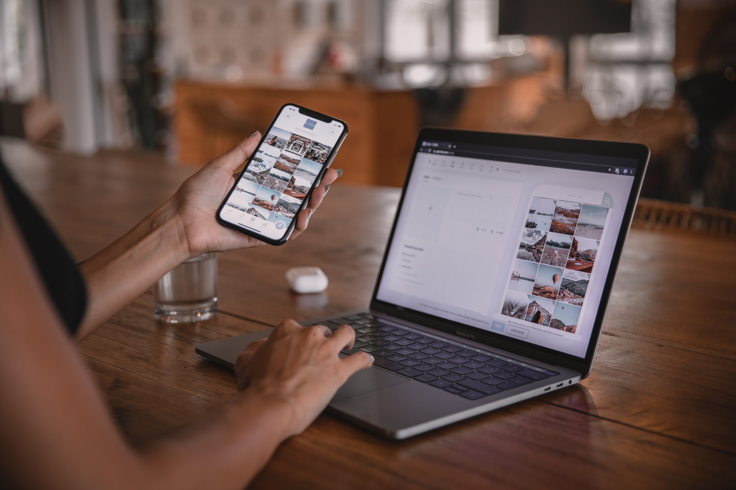 Woman researching social media whitelisting on her phone and laptop