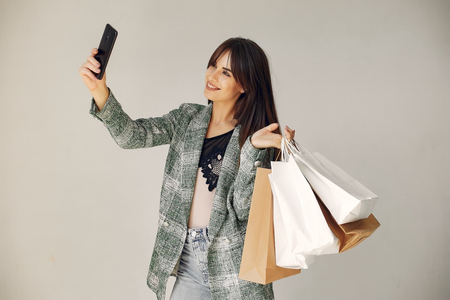 a woman taking a selfie to learn how to become a brand ambassador for clothing companies