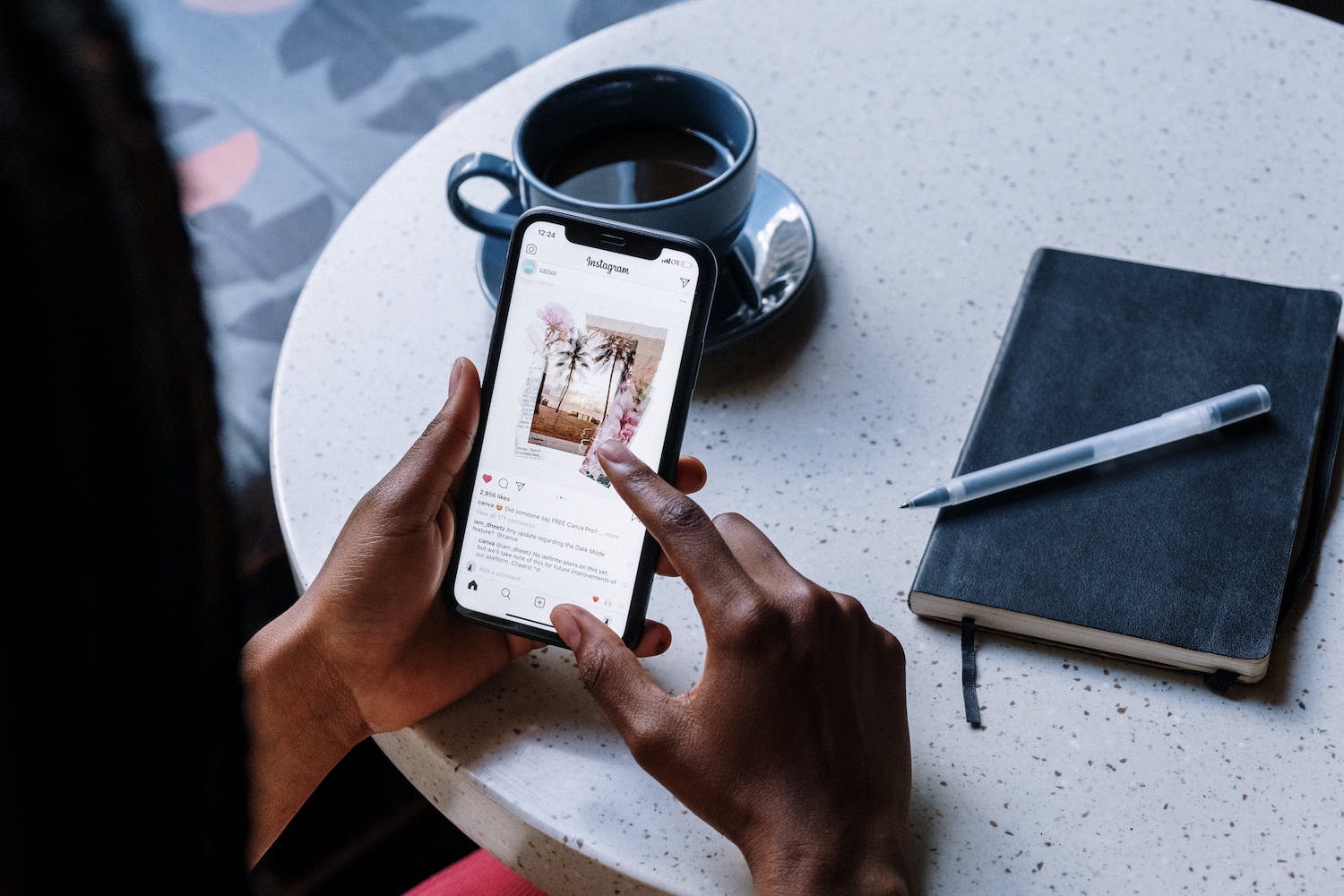 A woman on her phone learning how to make money on Instagram.