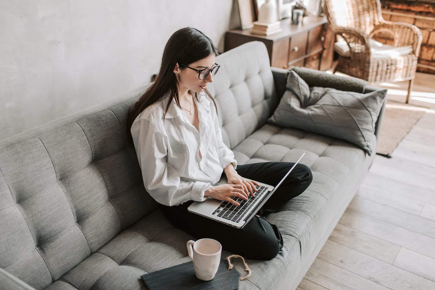 A woman on her laptop researching how much does TikTok pay.