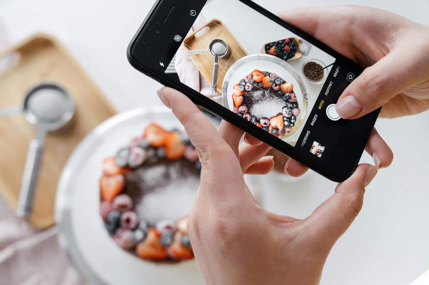 A person capturing food content to understand how to use Pinterest for blogging.