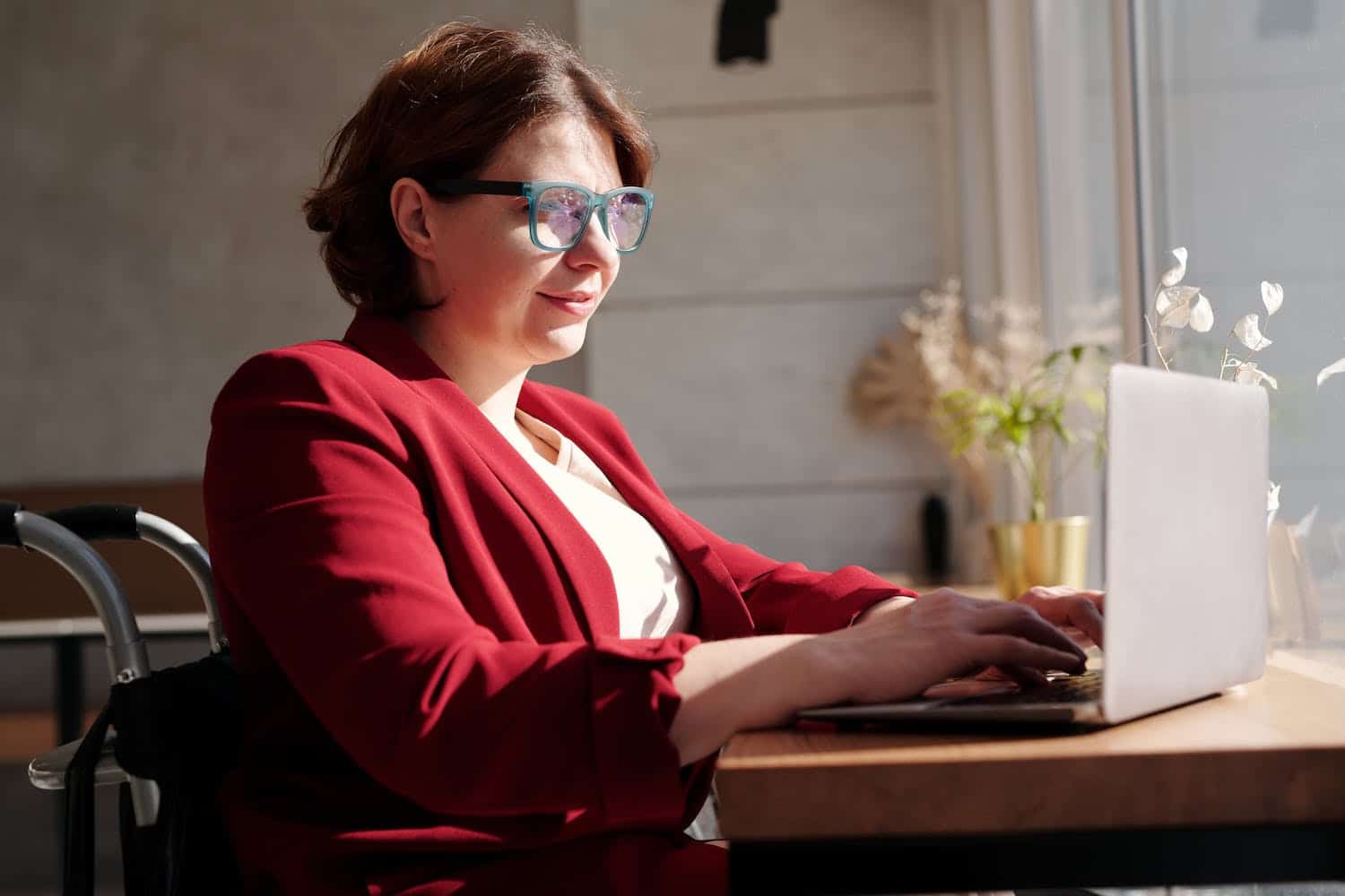 A woman on her computer, researching what is a digital creator.