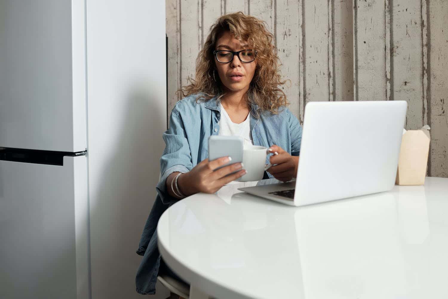 A woman on her phone, researching what is a digital creator.