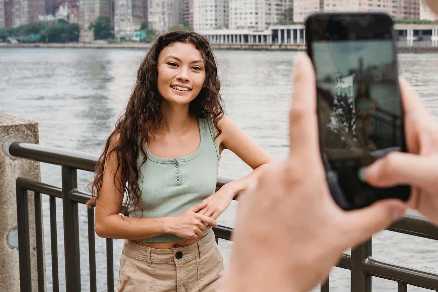 A person taking a video of a Creator for hyperlocal social media marketing.