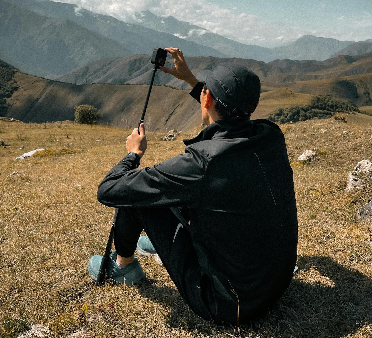 A creator taking photos of scenery to use hyperlocal social media marketing.